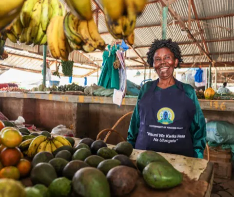 A produce trader at a Makueni county market